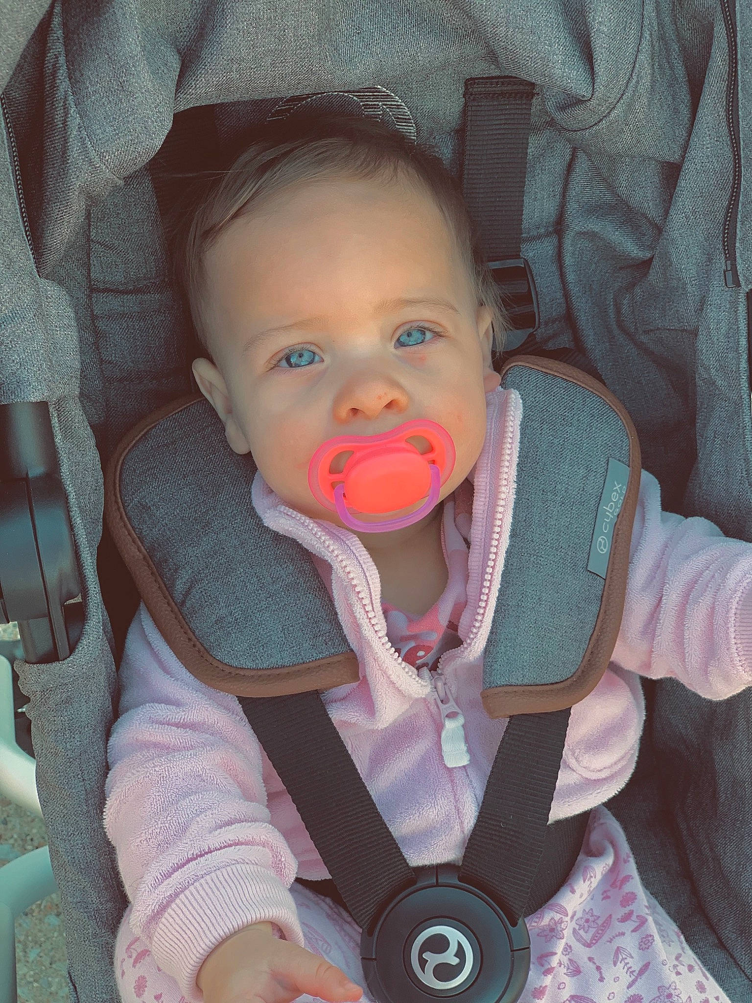 Kyler is registered to the contest to win money with this photo: arm, baby, baby_carriage, baby_toddler_clothing, cheek, chin, clothing, comfort, ear, eye, eyebrow, human_body, iris, lip, mouth, nose, organ, outerwear, person, product