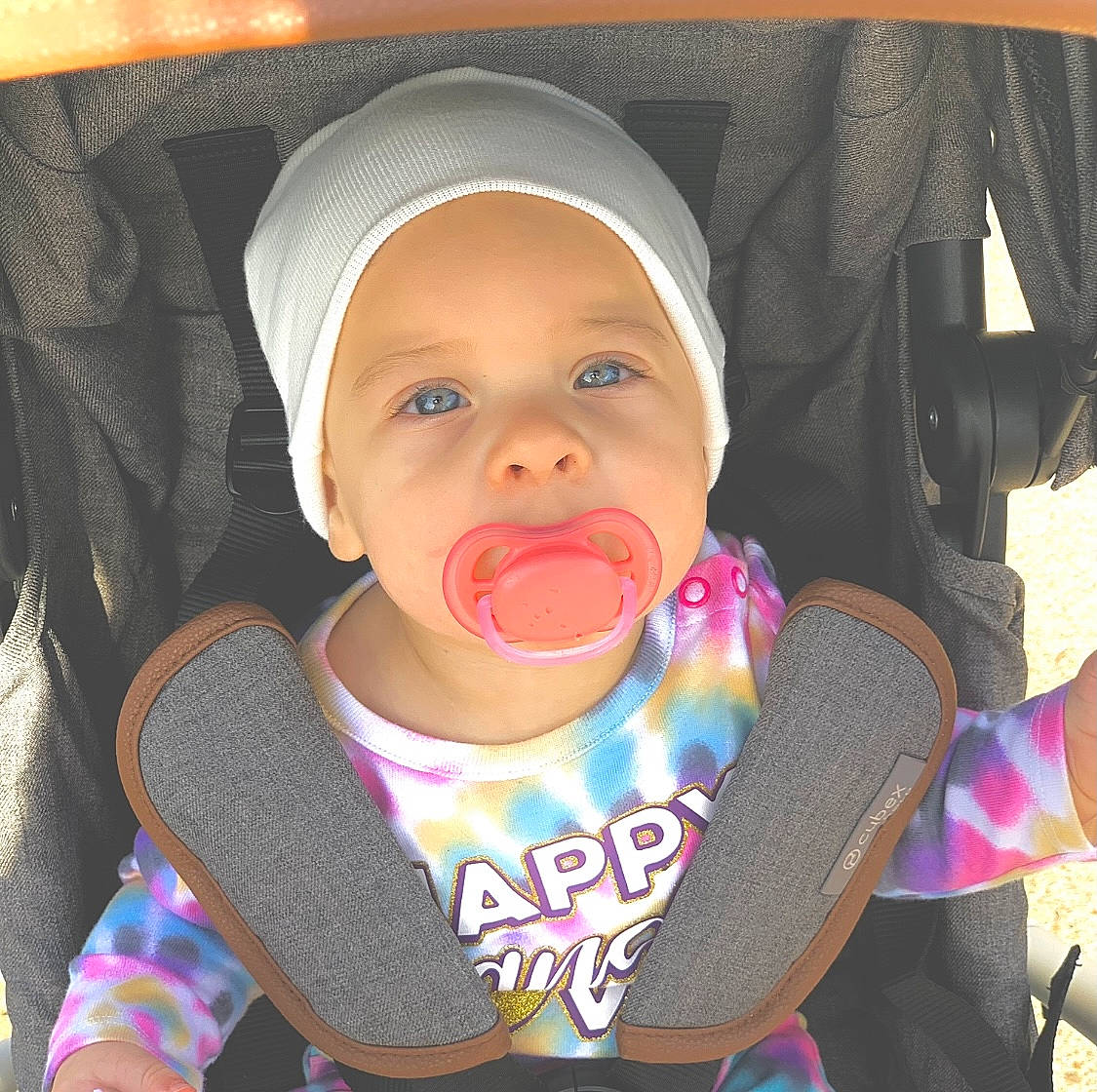 Kyler is registered to the contest to win money with this photo: baby, baby_toddler_clothing, cheek, clothing, comfort, ear, facial_expression, finger, happy, headwear, iris, lip, mouth, nose, organ, outerwear, person, pink, product, skin