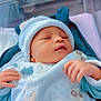 Fatim participe au concours pour gagner de l'argent avec cette photo : newborn, baby, infant, sleeping, hat, pajamas, crib, hospital, bassinet, soft_toys, clothing, cute, peaceful, child, person, indoors, blanket, resting, portrait, sleepy