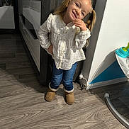 Juliana a rejoint le concours — aidez-le/la à gagner de superbes lots ! child, girl, smiling, pigtails, white_blouse, stars, jeans, boots, indoor, wooden_floor, cabinet, decor, playful, happy, portrait, leaning, floor, person, home, cute