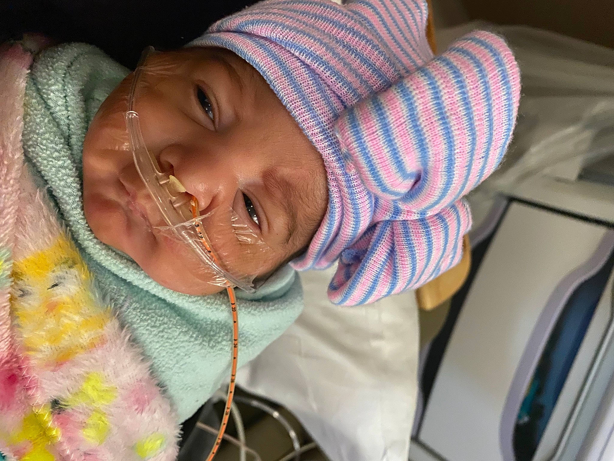 Justice is registered to the contest to win money with this photo: baby, cap, cheek, child, eye, eyelash, face, finger, fun, happy, headwear, human_body, iris, lip, mouth, neck, nose, person, skin, smile