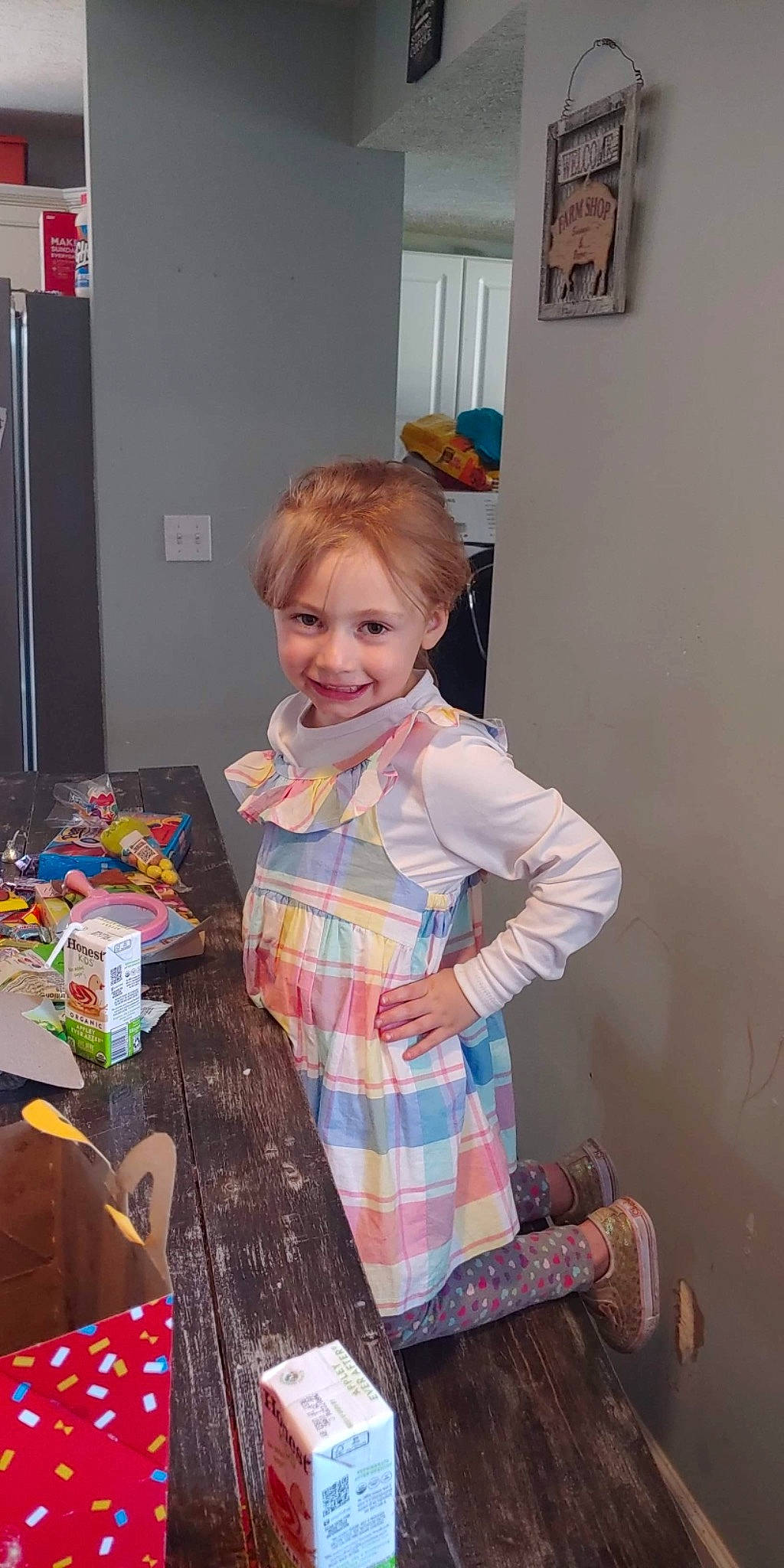 Addyson joined the competition — help win amazing prizes! blond, child, dress, event, fashion_design, flooring, fun, holiday, joy, party, pattern, people, person, picture_frame, plaid, play, room, sitting, smile, sock