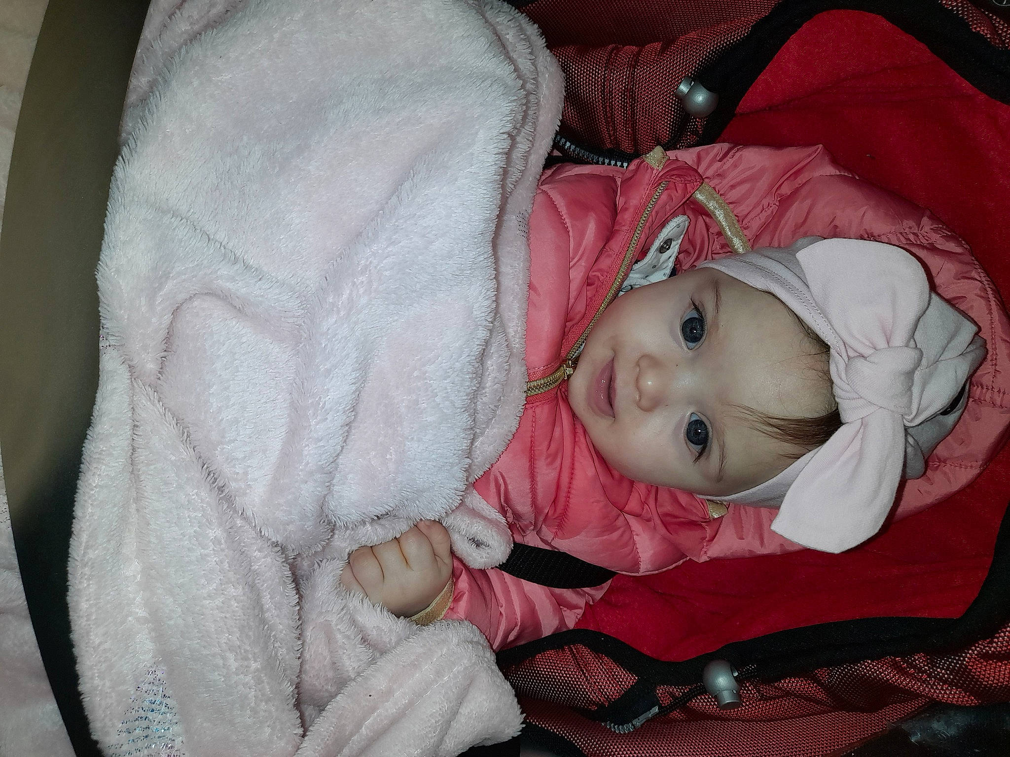 Alyana participe au concours pour gagner de l'argent avec cette photo : baby, baby_toddler_clothing, cheek, child, comfort, eye, facial_expression, head, headgear, headwear, human_body, iris, lip, nose, person, pink, sitting, skin, sleeve, smile