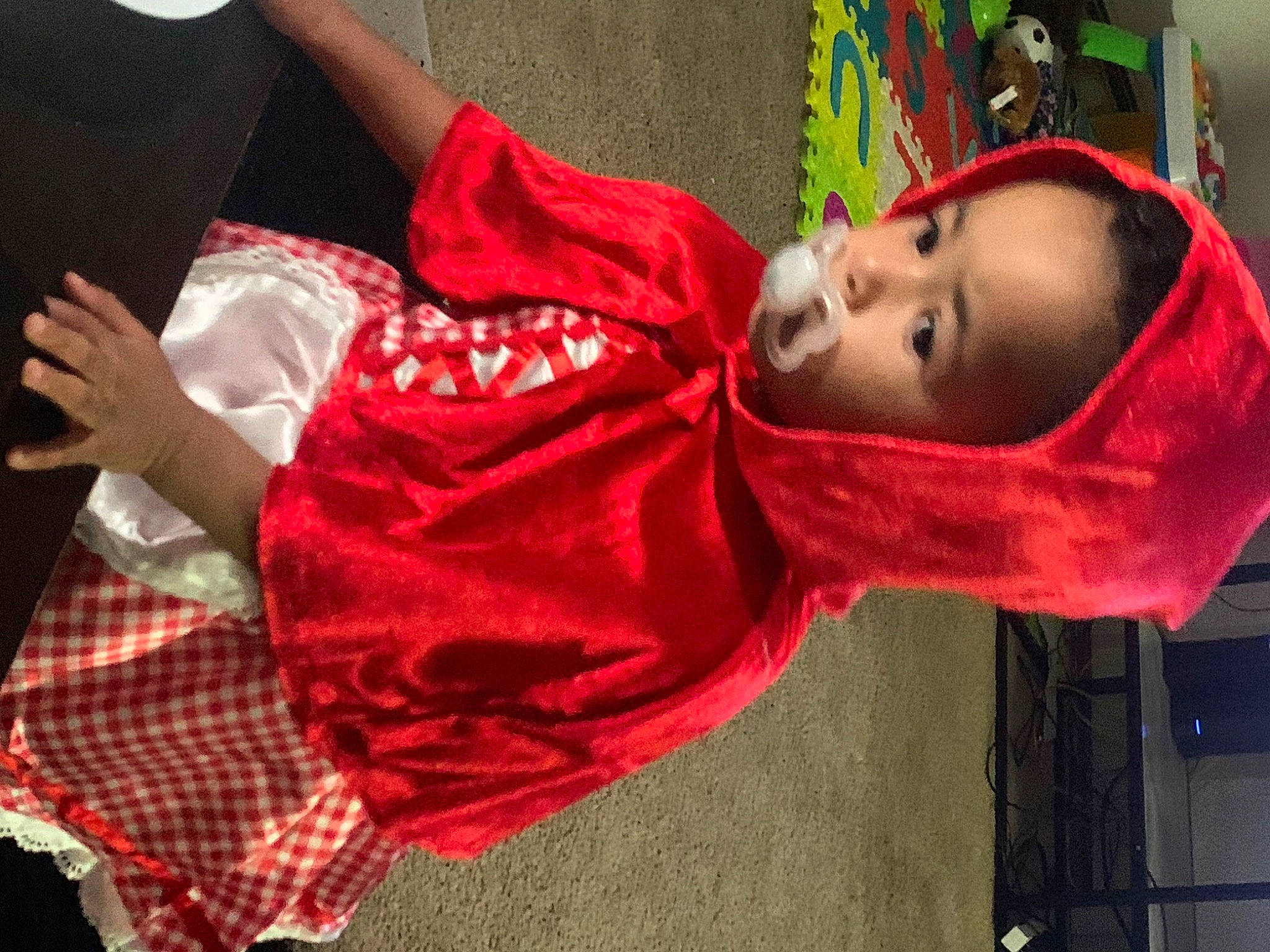 Amara is registered to the contest to win money with this photo: child, entertainment, event, fun, happy, leisure, magenta, pattern, performance, performance_art, performing_arts, person, plaid, play, room, sitting, smile, tartan, toddler, tradition