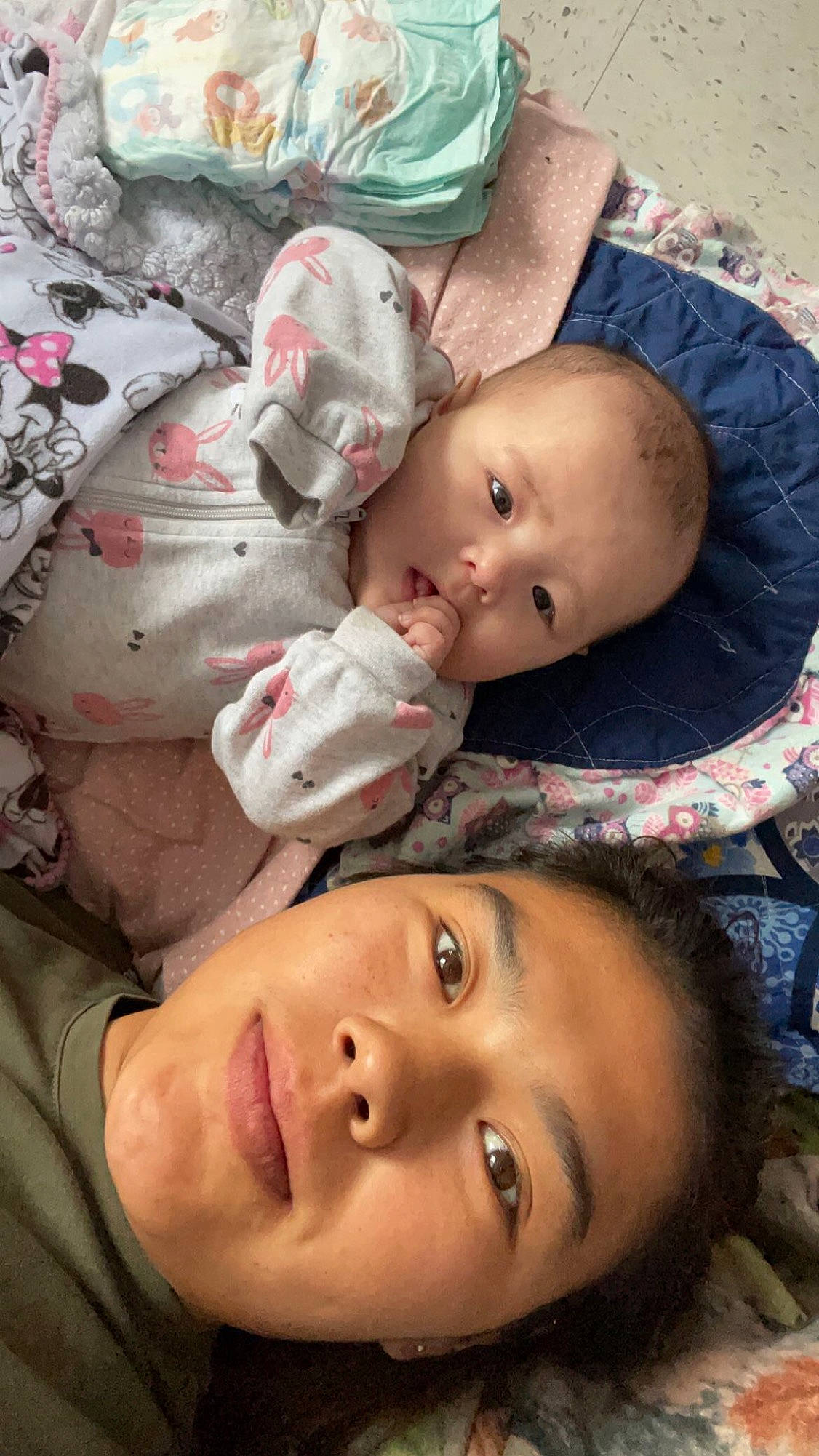 Olivia is registered to the contest to win money with this photo: baby, baby_products, baby_toddler_clothing, cheek, child, chin, comfort, eyelash, facial_expression, forehead, fun, happy, linens, lip, mouth, nose, pattern, person, skin, textile