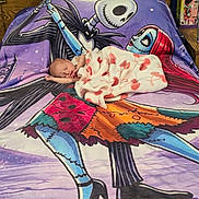 Pru is registered to the contest to win money with this photo: newborn, baby, sleeping, infant, portrait, blanket, fleece, hearts, halloween, jack_skellington, skeleton, plush_toy, bed, bedding, bedroom, colorful, purple, cozy, peaceful, indoors