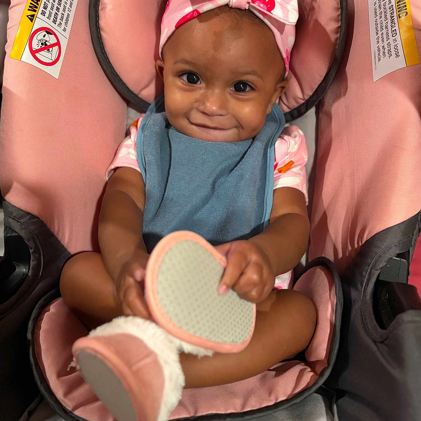 Nalanni joined the competition — help win amazing prizes! baby, child, infant, smiling, portrait, stroller, pink, headband, bow, bib, shoes, fuzzy_shoes, sitting, indoors, close_up, happy, face, fashion, parenting, photography