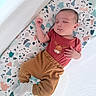 baby, child, closeup, clothing, cozy, crib, cushion, indoor, infant, moose_graphic, newborn, pants, patterned, peaceful, portrait, resting, shirt, sleeping, socks, soft_lighting