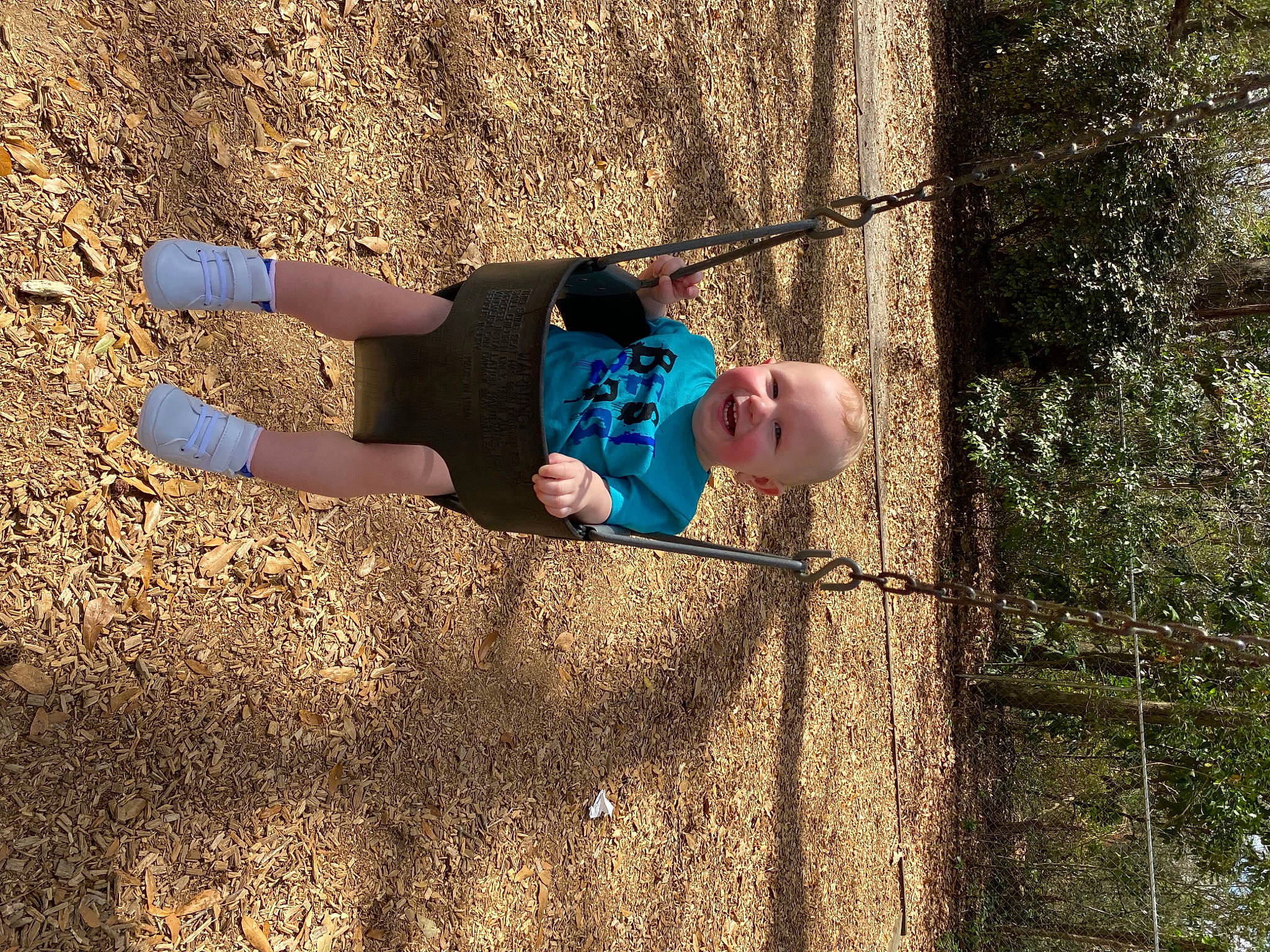 Corbin joined the competition — help win amazing prizes! child, electric_blue, fun, grass, happy, joy, landscape, leisure, outdoor_play_equipment, people_in_nature, person, play, recreation, shadow, soil, swing, t_shirt, tints_and_shades, toddler, tree