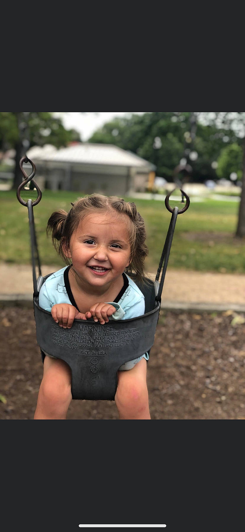 Emberly Willow joined the competition — help win amazing prizes! baby_toddler_clothing, child_model, happy, human_settlement, joy, laugh, outdoor_play_equipment, person, play, playground, portrait_photography, public_space, swing, toddler