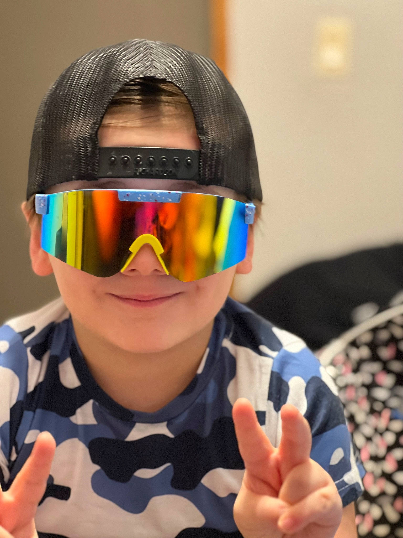 Brandon joined the competition — help win amazing prizes! child, costume, electric_blue, entertainment, eyewear, fashion_accessory, finger, fun, gesture, goggles, happy, hearing, nail, person, personal_protective_equipment, sign_language, sports_gear, thumb, toddler, vision_care