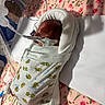 baby, premature, hospital, blanket, medical_tubes, floral_pattern, pink, neonatal_care, infant, bed, healthcare, newborn, wrapped, cute, patient, medical_equipment, small, child, resting, person