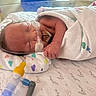 Ayla joined the competition — help win amazing prizes! newborn, baby, hospital, blanket, medical_tube, sleeping, infant, face, hand, bed, healthcare, patient, wrapped, cute, peaceful, premature, cute_baby, child, pediatric, resting