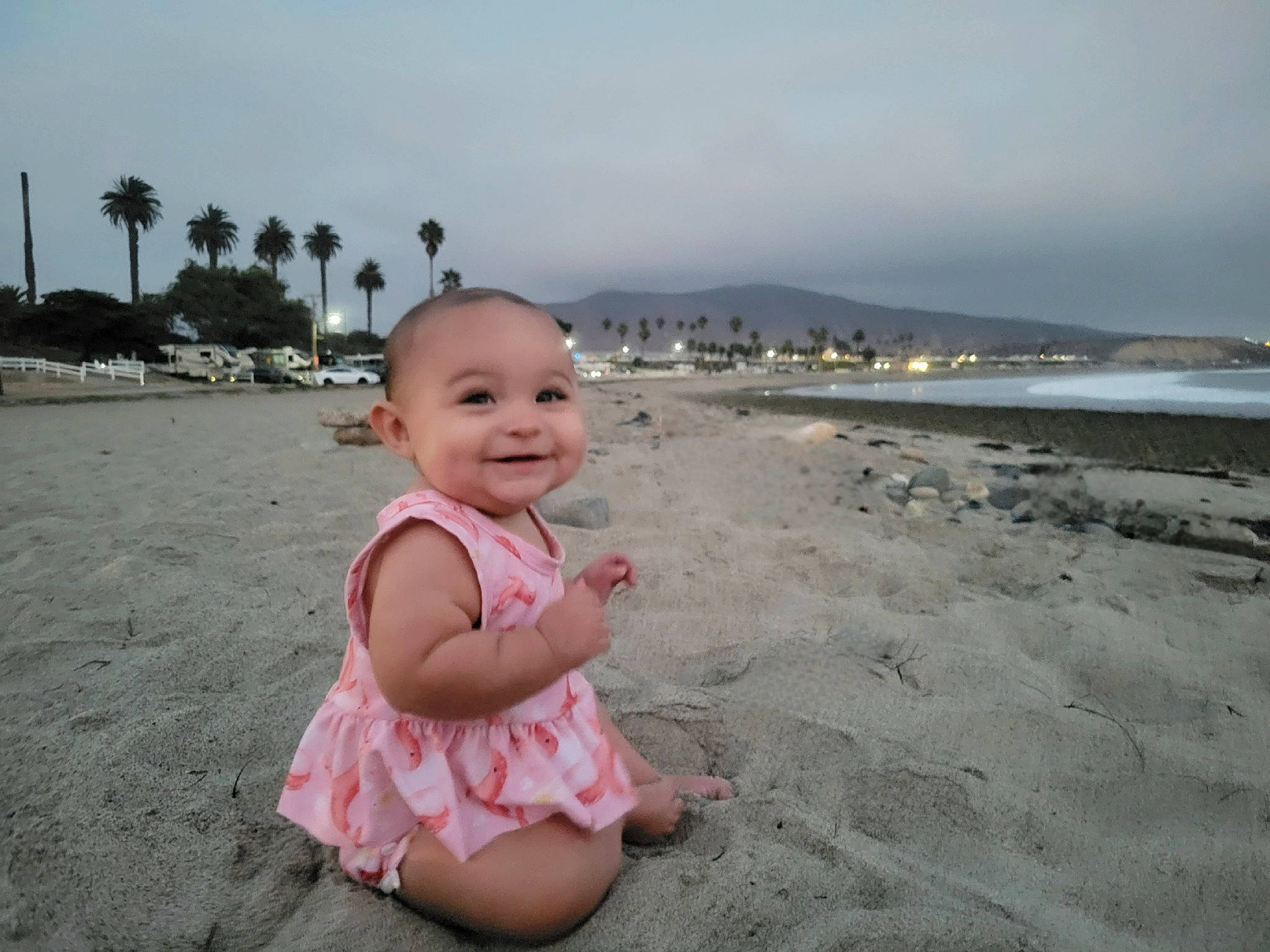 Davina is registered to the contest to win money with this photo: baby, baby_toddler_clothing, beach, cloud, fun, happy, hat, holiday, horizon, joy, leisure, palm_tree, people_on_beach, person, plant, shore, sky, smile, toddler, travel