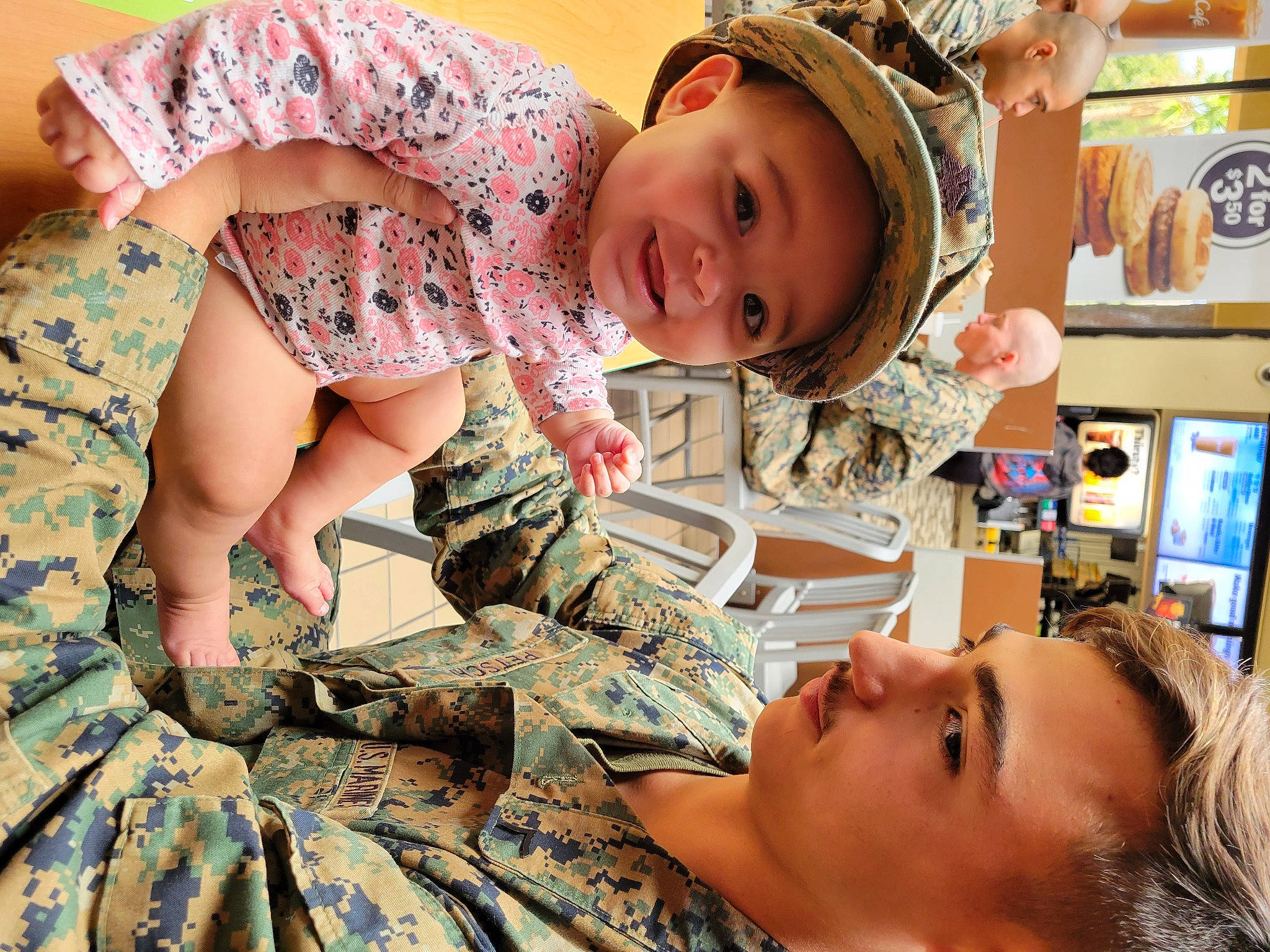 Davina is registered to the contest to win money with this photo: baby, baby_toddler_clothing, camouflage, cap, child, design, facial_expression, fun, happy, headwear, human, military_camouflage, military_uniform, organ, pattern, people, person, skin, smile, thigh