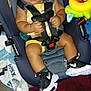 Mateo is registered to the contest to win money with this photo: baby, baby_boy, blanket, car_seat, car_seat_harness, child, childcare, clothing, colorful, cute, floor, footwear, indoor, infant, person, seatbelt, sitting, sneakers, toddler, toy