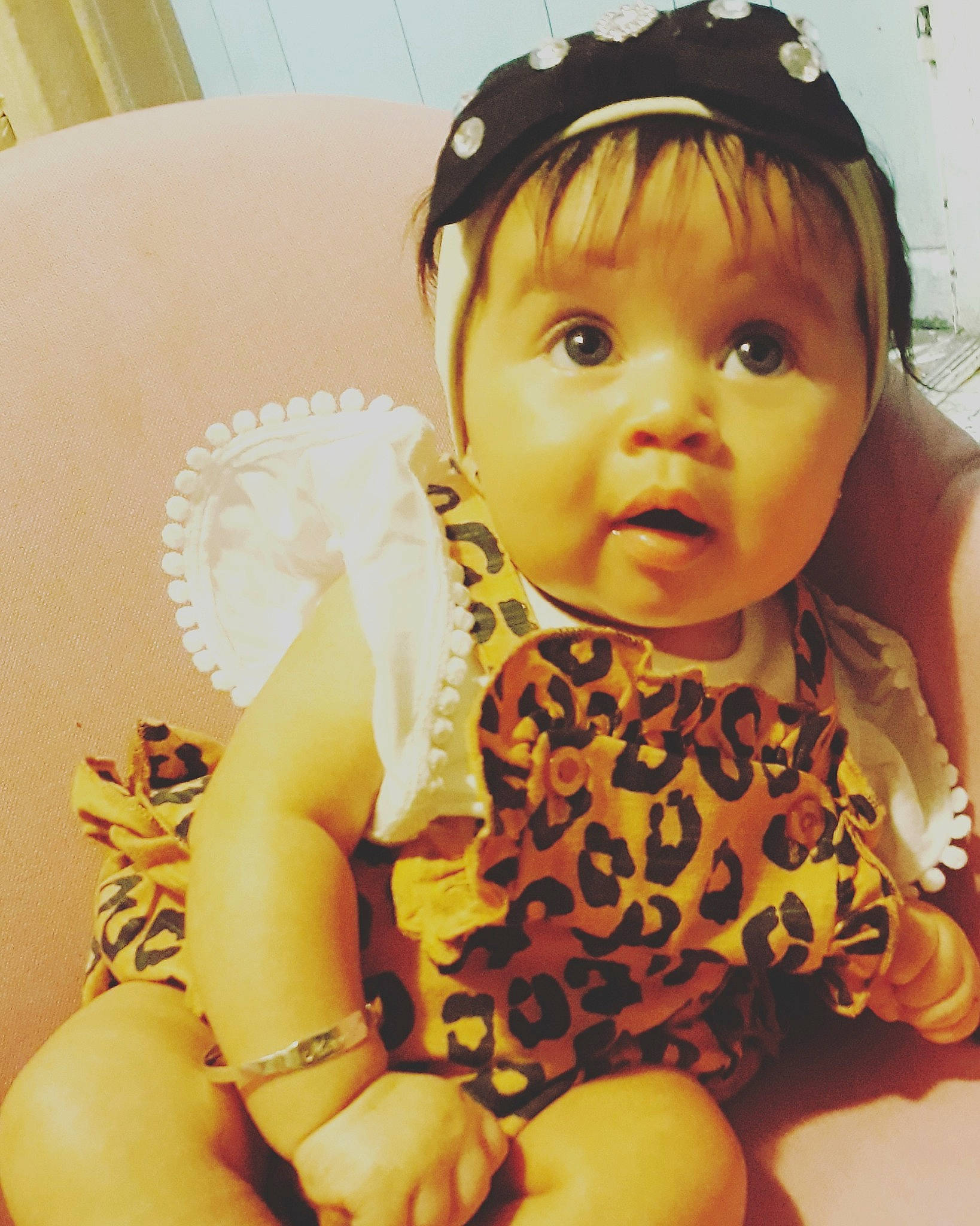 Miralee is registered to the contest to win money with this photo: baby, baby_toddler_clothing, cheek, child, ear, eye, fashion_accessory, hair_accessory, headband, headgear, headpiece, person, photography, skin, smile, surprise, toddler, yellow