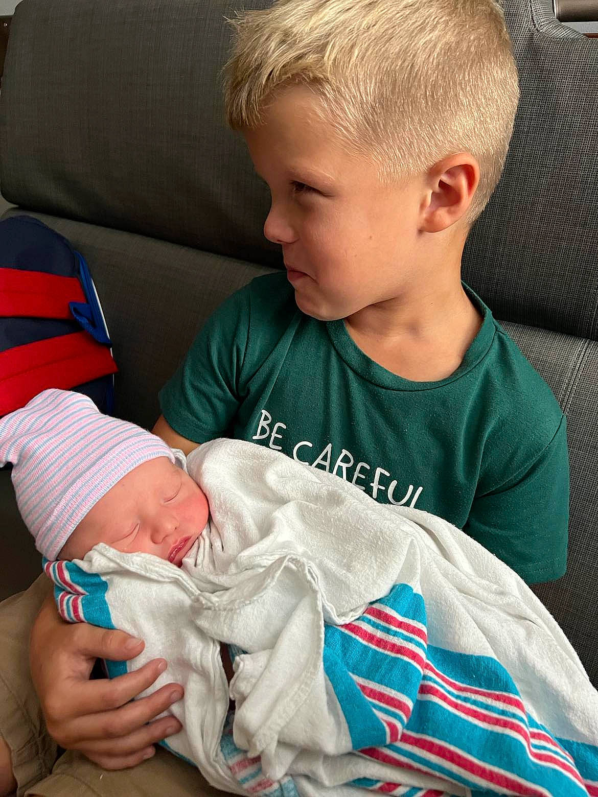 Jamison is registered to the contest to win money with this photo: abdomen, baby, baby_products, baby_toddler_clothing, cheek, child, chin, comfort, couch, elbow, happy, head, headwear, joint, lap, mouth, person, product, sitting, skin