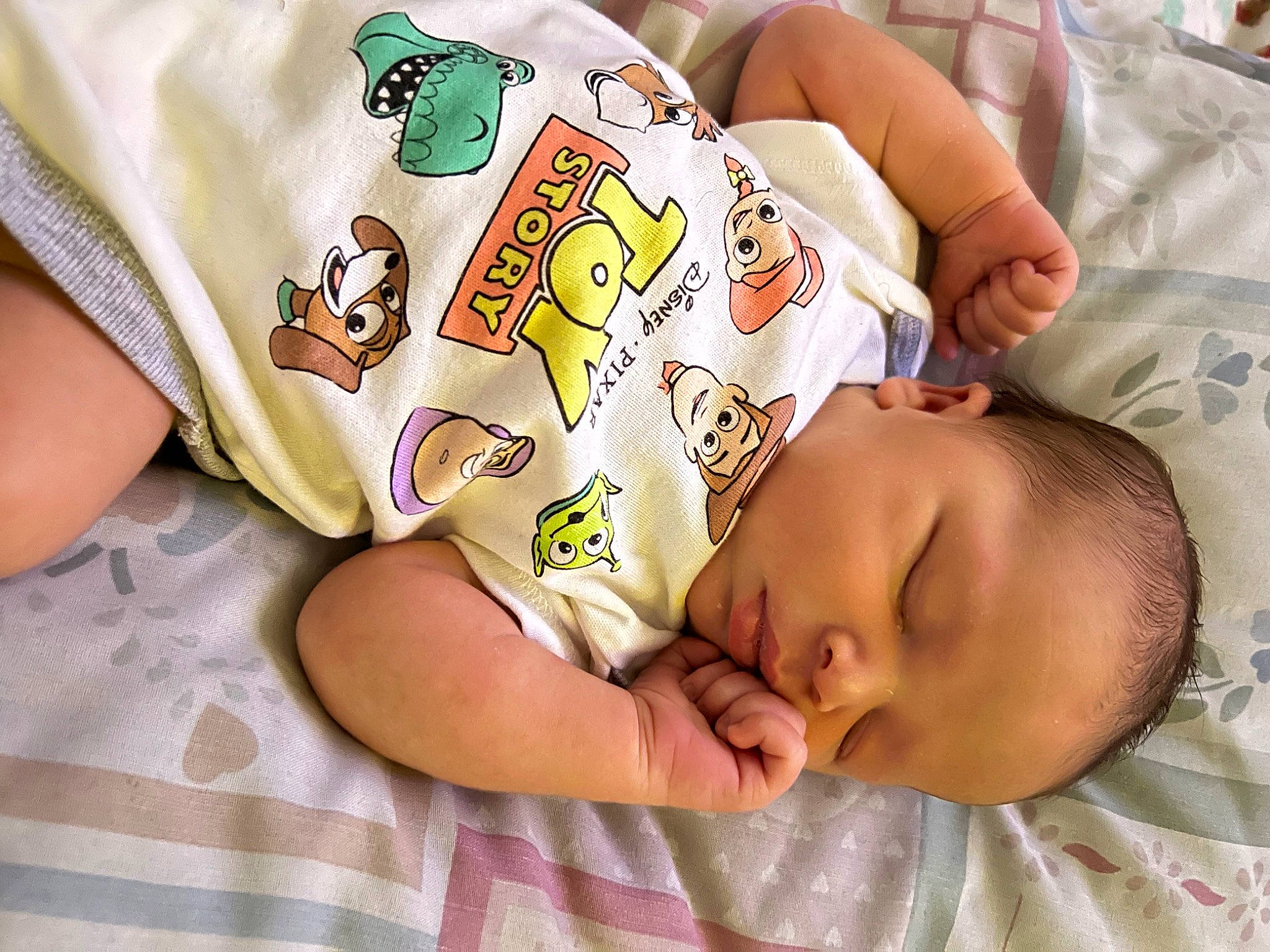 Maverick is registered to the contest to win money with this photo: baby, baby_products, baby_sleeping, baby_toddler_clothing, bedding, bedtime, cheek, child, comfort, happy, human_body, linens, mouth, nap, pattern, person, room, skin, sleep, sleeve