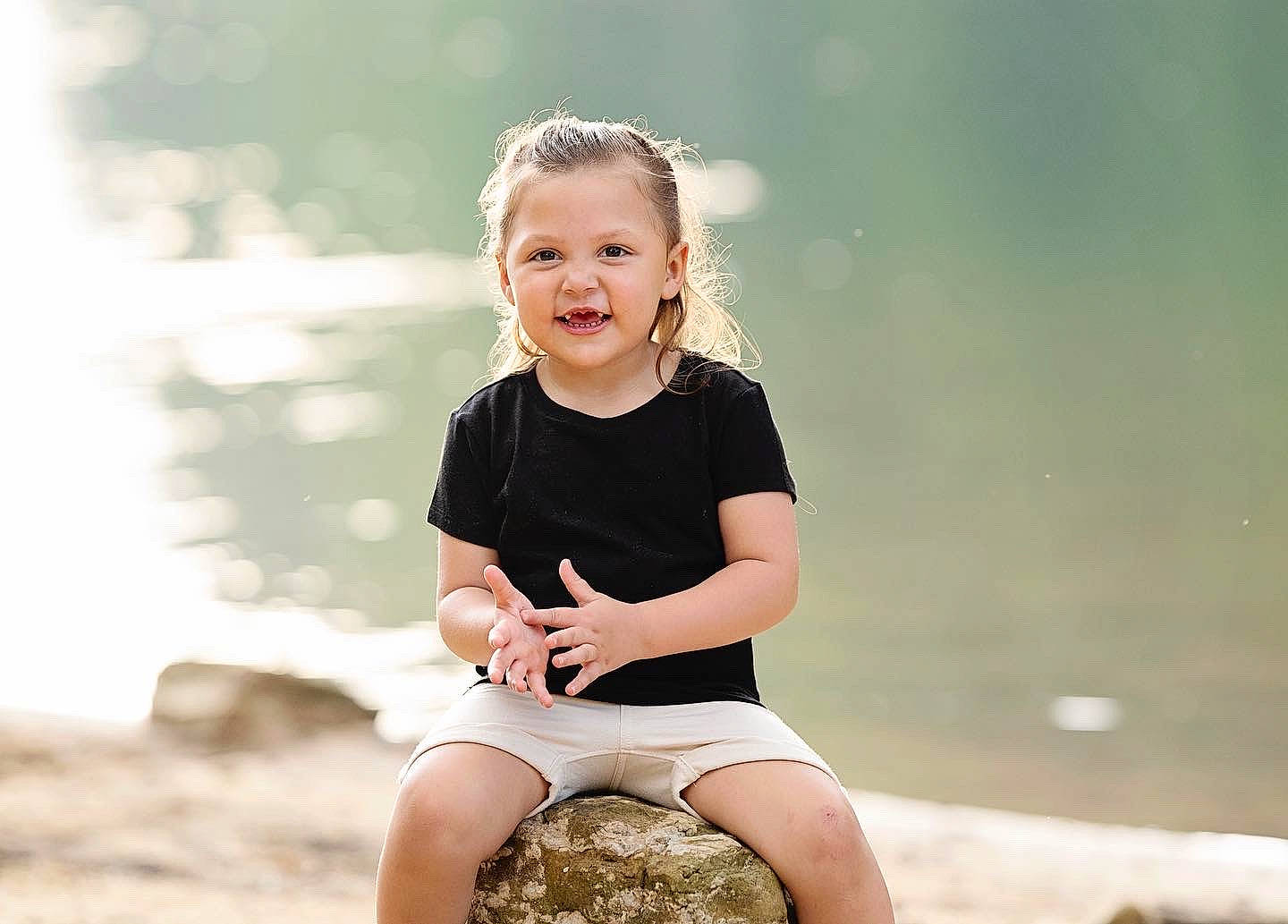 Lindsay is registered to the contest to win money with this photo: blond, brown_hair, child, flash_photography, fun, grass, happy, human_leg, joy, knee, leisure, people_in_nature, person, sand, shorts, shoulder, sitting, smile, sunlight, t_shirt