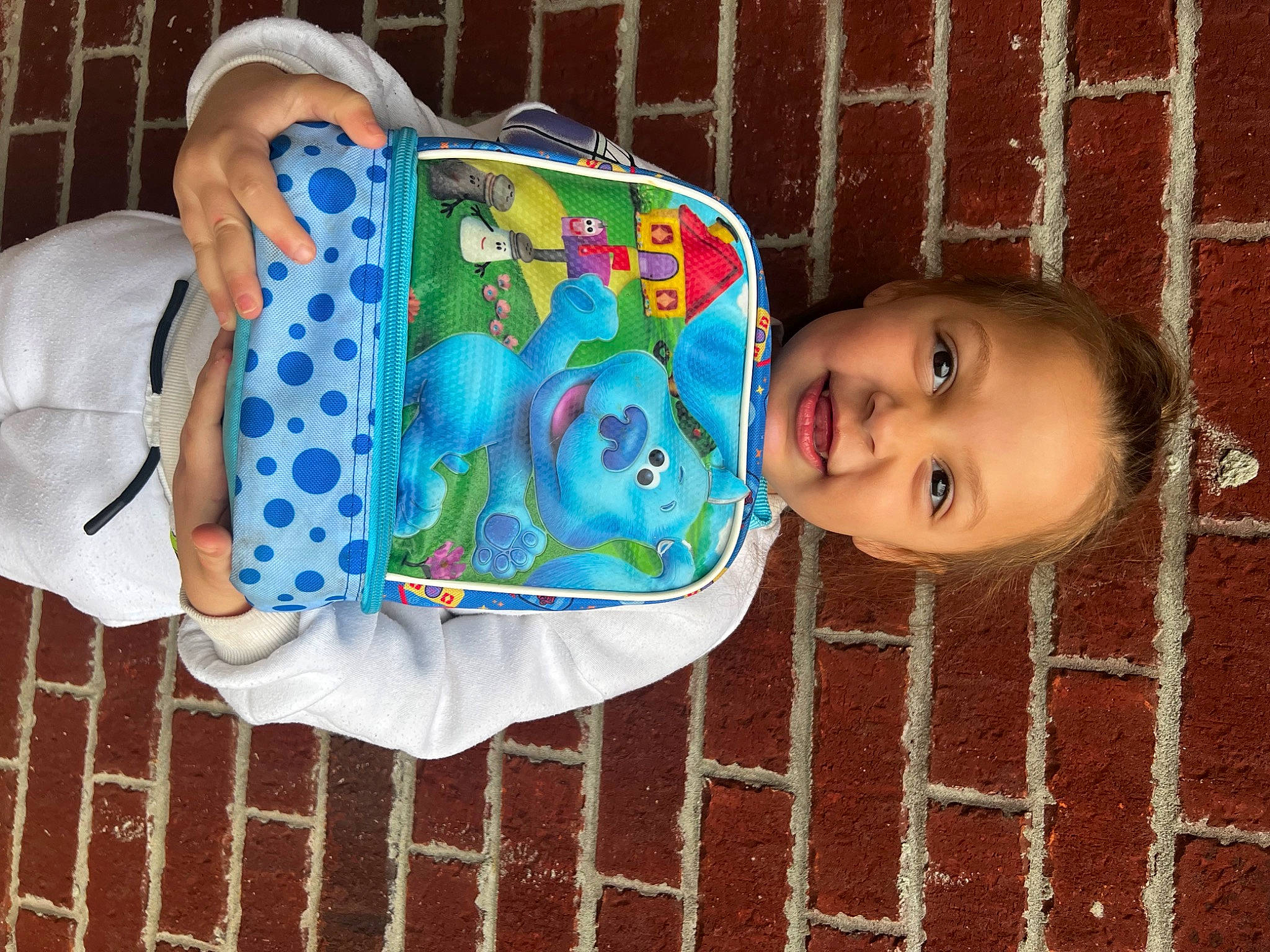 Lindsay is registered to the contest to win money with this photo: art, baby, baby_products, baby_toddler_clothing, brick, cheek, child, flooring, happy, head, joy, linens, mouth, pattern, person, personal_protective_equipment, plastic, product, sleeve, smile