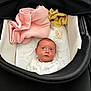 Clara joined the competition — help win amazing prizes! baby, infant, stroller, blanket, pacifier, clothing, face, head, soft, cute, newborn, child, resting, indoors, comfort, looking_up, white, pink, yellow, black