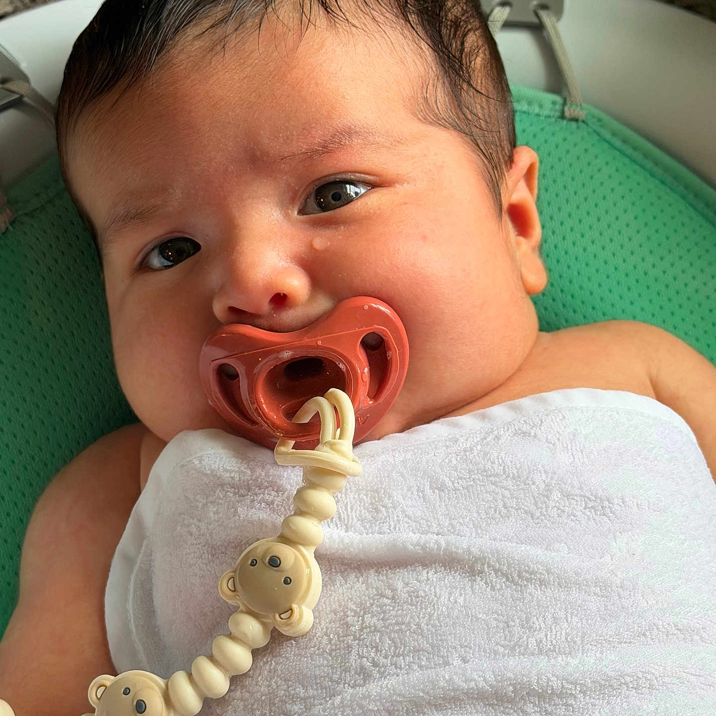 Thiago joined the competition — help win amazing prizes! baby, baby_gear, bare_arms, blanket, child, close_up, eyes_open, face, green_seat, indoors, infant, lying_down, pacifier, pacifier_clip, photography, portrait, sitting, sleepy, wet_hair, white_towel