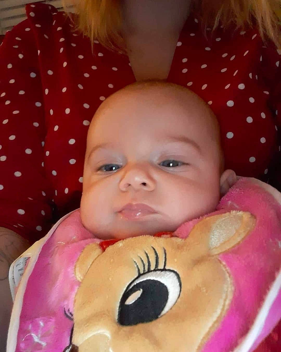 Lea is registered to the contest to win money with this photo: baby, baby_products, baby_toddler_clothing, baby_toys, bib, blond, cheek, child, iris, lip, love, organ, person, plush, polka_dot, skin, toddler