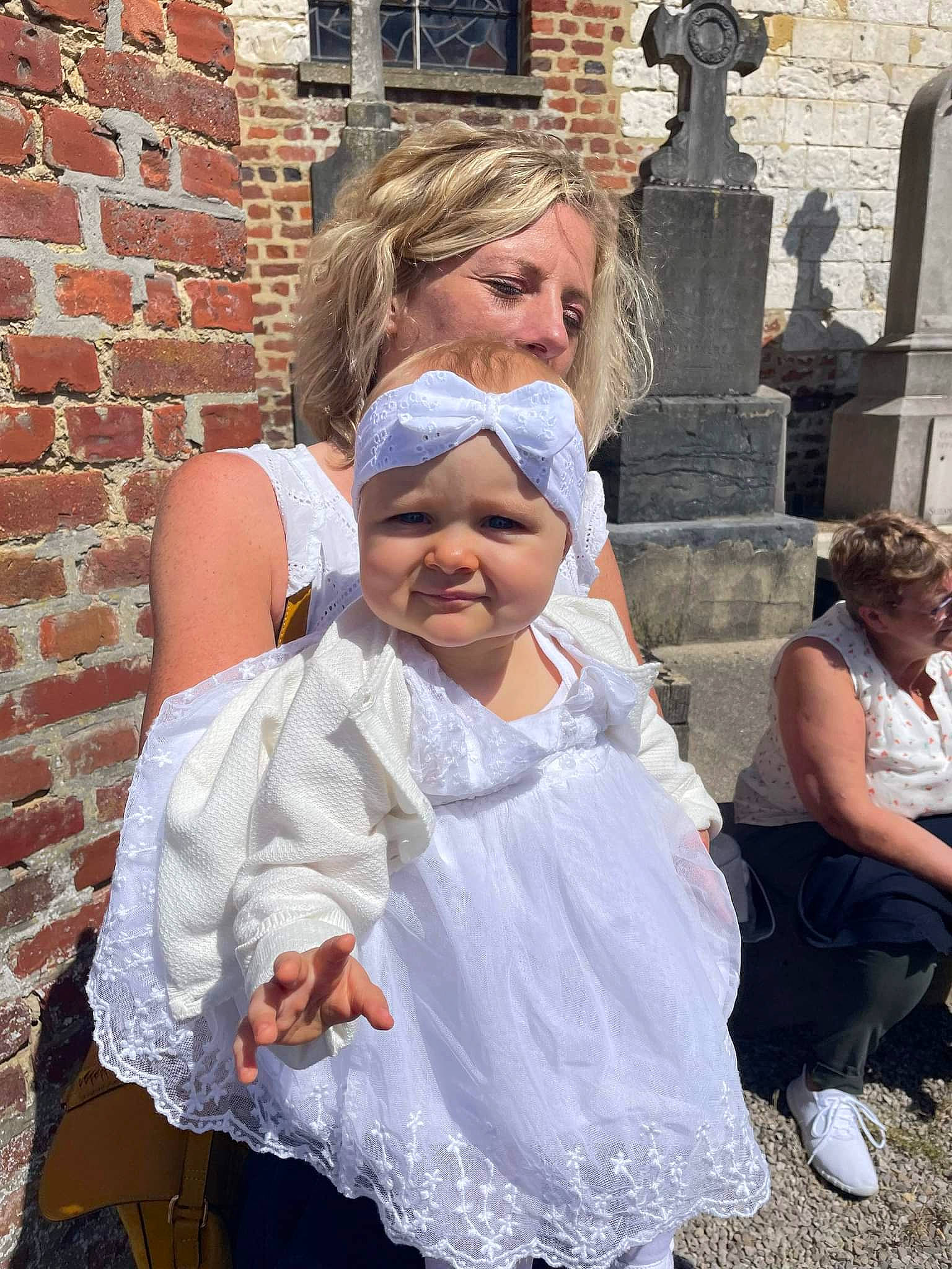 Eléana a rejoint le concours — aidez-le/la à gagner de superbes lots ! baby, brick, brickwork, bridal_accessory, bridal_clothing, child, dress, event, formal_wear, fun, gown, happy, head, headgear, headwear, person, smile, toddler, tradition, veil