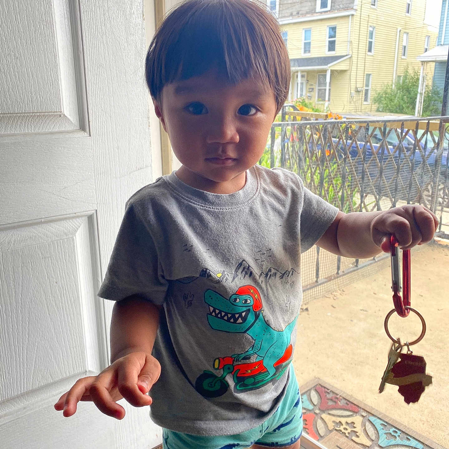 Rome is registered to the contest to win money with this photo: bodypart, boy, child, city, clothing, door, face, finger, hand, head, key, male, person, photography, portrait, road, shorts, sleeve, street, t_shirt
