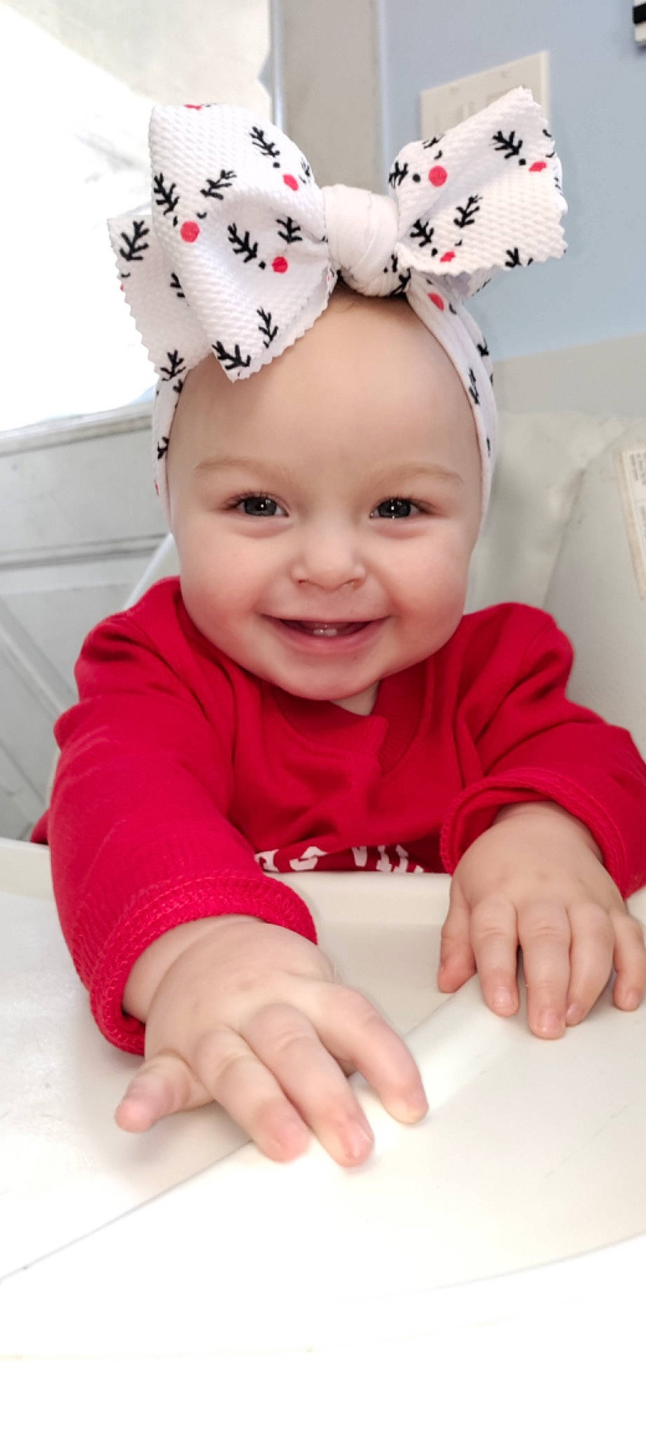 Laveyah is registered to the contest to win money with this photo: baby, baby_toddler_clothing, cap, cheek, child, costume_hat, eye, face, facial_expression, happy, head, headwear, joy, person, pink, product, red, skin, sleeve, smile