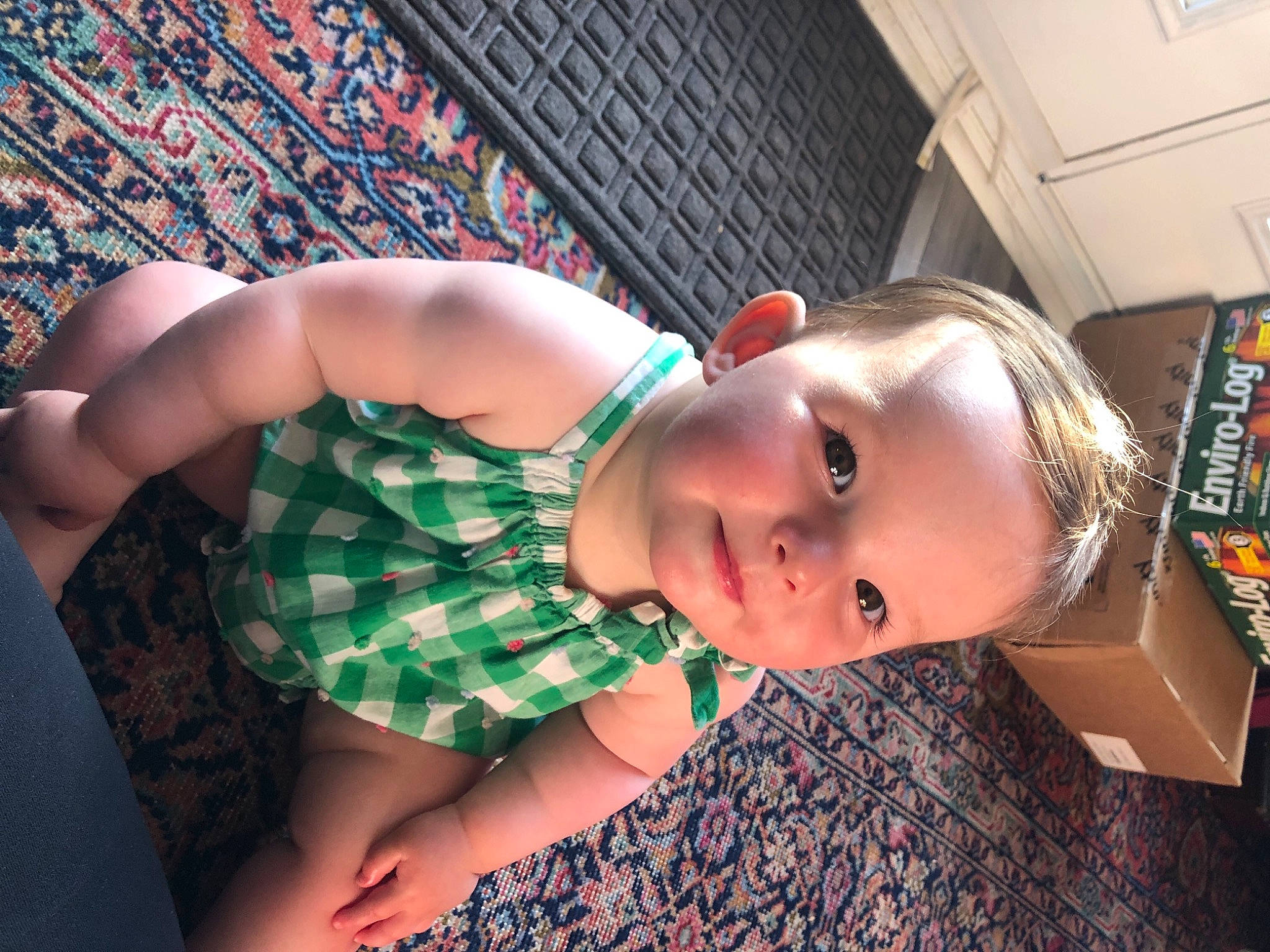 June is registered to the contest to win money with this photo: chest, child, cool, elbow, eyewear, flash_photography, flesh, fun, happy, human_leg, leisure, lip, mouth, pattern, person, plaid, portrait_photography, sitting, tartan, toddler