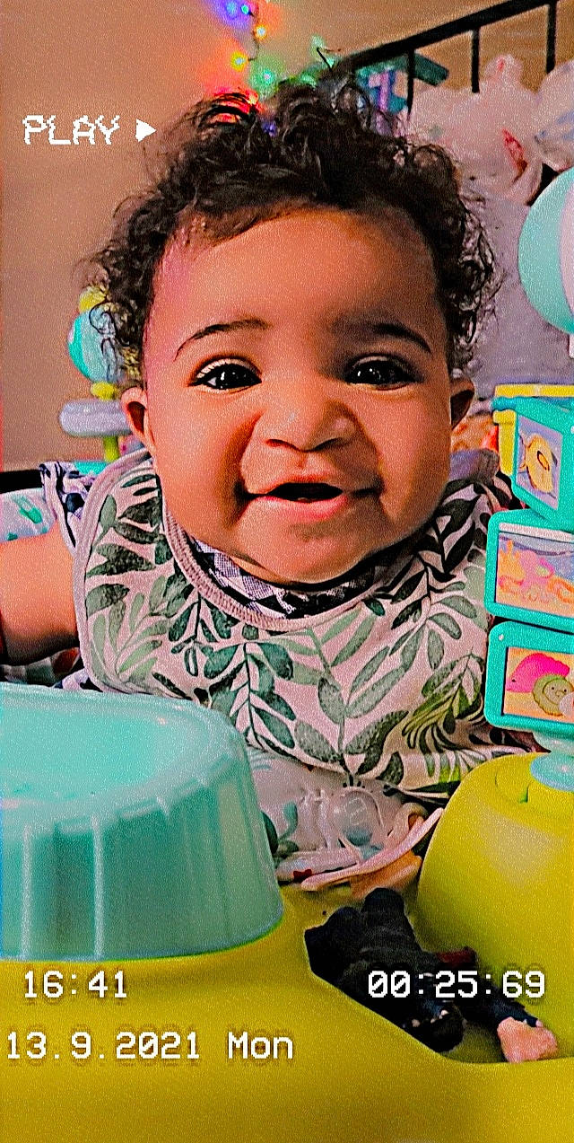 Legacy is registered to the contest to win money with this photo: baby, baby_playing_with_toys, baby_toddler_clothing, cheek, child, facial_expression, fun, hairstyle, happy, iris, leisure, nose, person, pink, play, product, skin, smile, sweetness, toddler