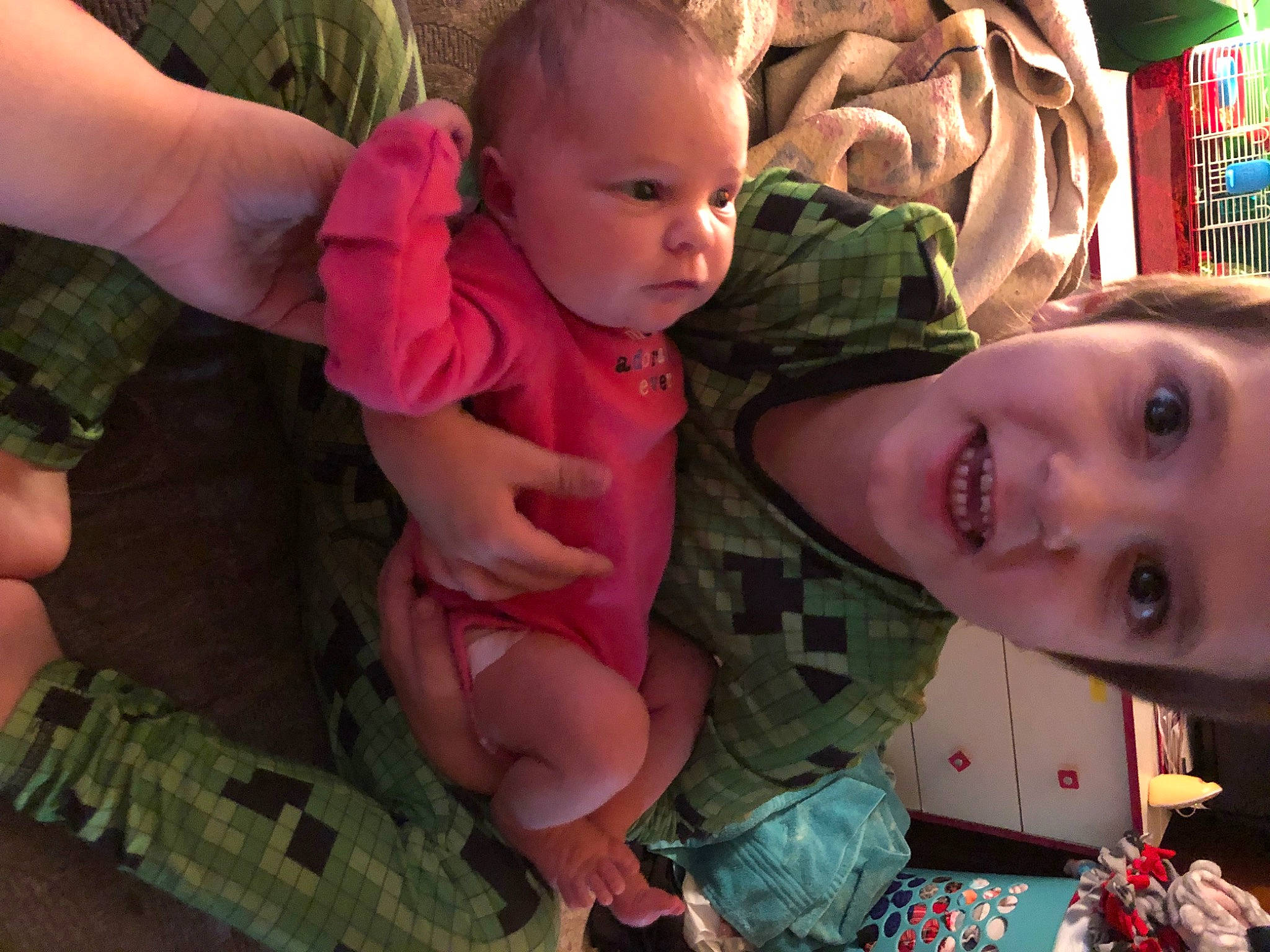 Ayden is registered to the contest to win money with this photo: baby, baby_toddler_clothing, cheek, eye, face, facial_expression, finger, gesture, grass, green, hairstyle, happy, head, iris, leaf, mouth, nose, person, skin, smile