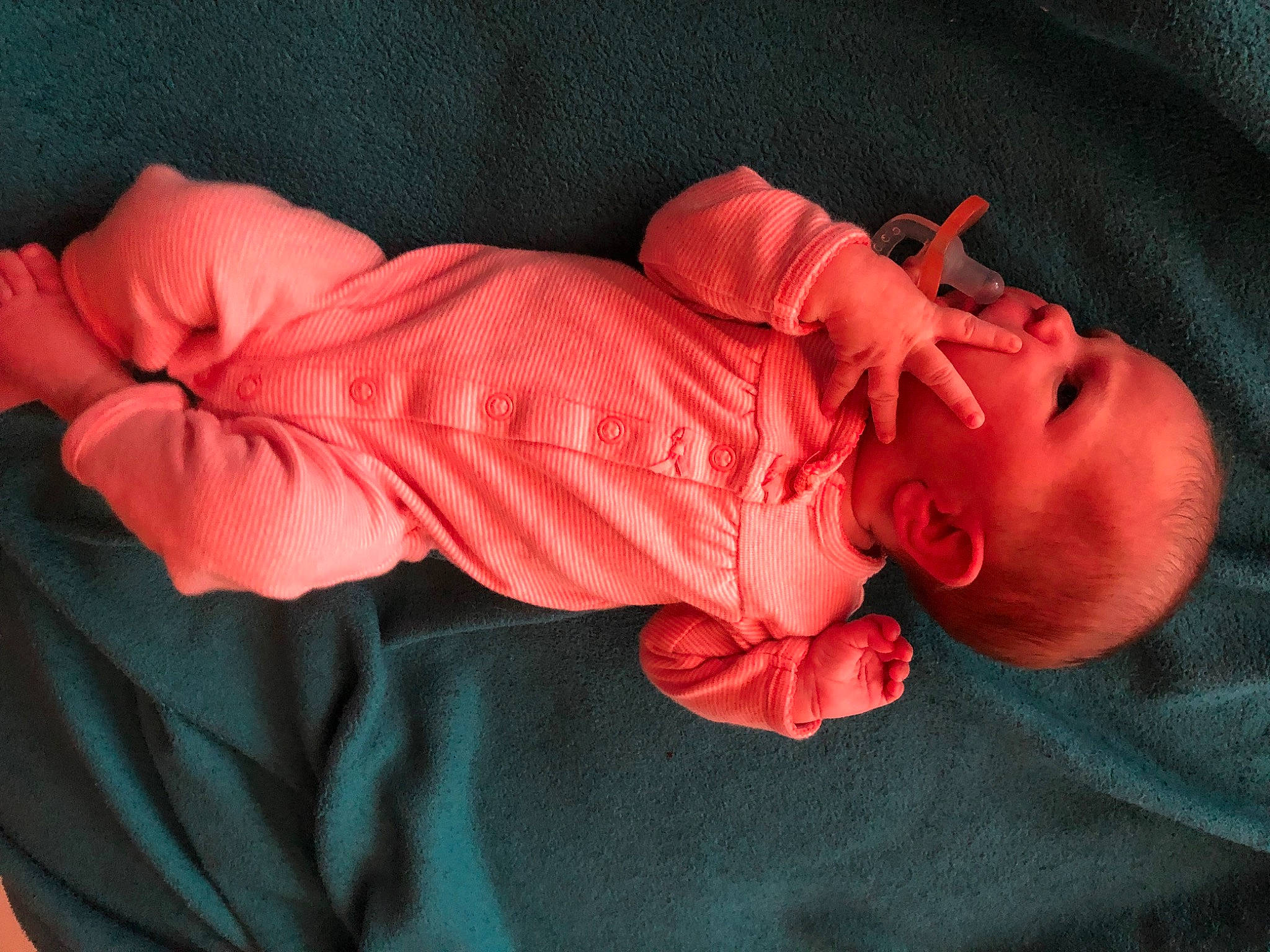 Serraphine is registered to the contest to win money with this photo: baby, baby_products, baby_toddler_clothing, carmine, child, comfort, eye, finger, hand, head, human_body, linens, magenta, mouth, orange, person, pink, product, sleeve, t_shirt