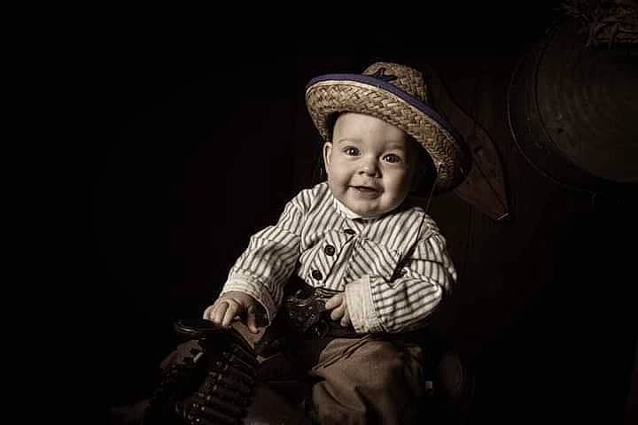 Jasper is registered to the contest to win money with this photo: art, baby, baby_toddler_clothing, cheek, child, darkness, entertainment, event, facial_expression, flash_photography, fun, happy, hat, headwear, joy, monochrome, monochrome_photography, person, sitting, smile