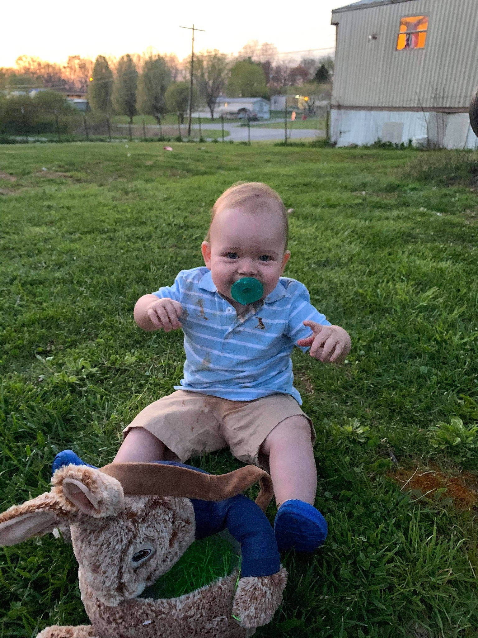 Jasper is registered to the contest to win money with this photo: baby, baby_toddler_clothing, child, electric_blue, fun, grass, grass_family, grassland, happy, human_leg, lawn, leg, leisure, people_in_nature, person, plant, shorts, sky, thigh, toddler
