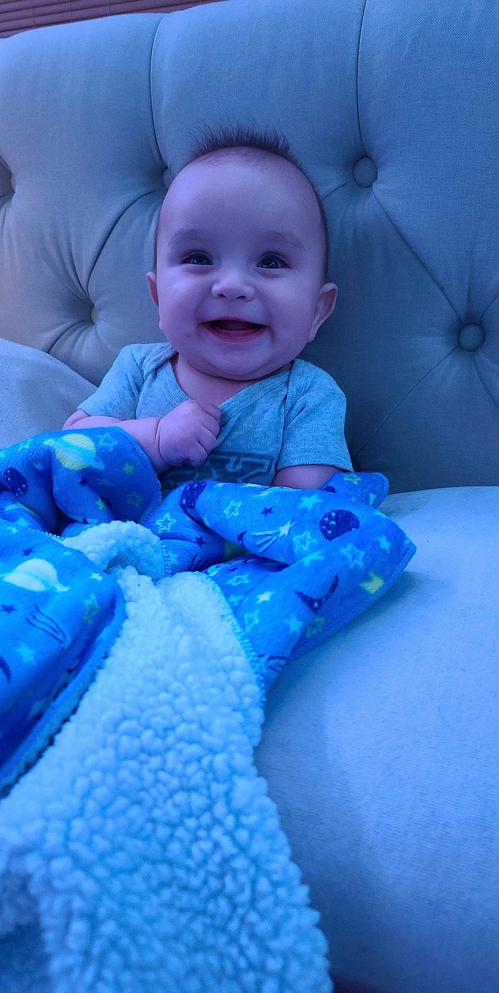 Adriel is registered to the contest to win money with this photo: azure, baby, baby_toddler_clothing, blue, cheek, comfort, eye, face, finger, happy, iris, joy, mouth, person, product, purple, skin, sleeve, smile, textile