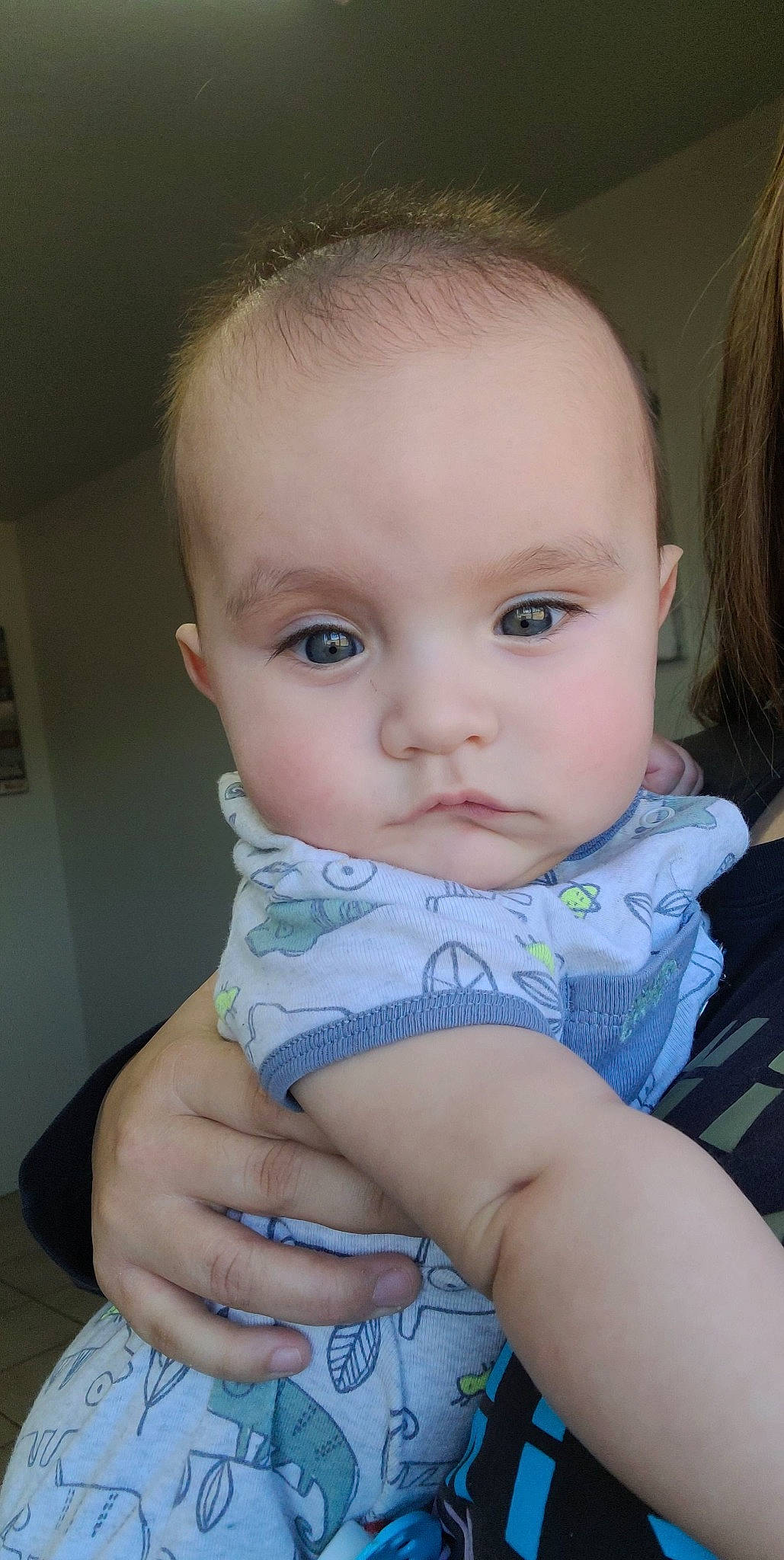 Adriel is registered to the contest to win money with this photo: baby, baby_toddler_clothing, cheek, chest, chin, eye, eyebrow, eyelash, finger, flash_photography, hand, iris, lip, mouth, neck, nose, person, picture_frame, skin, sleeve