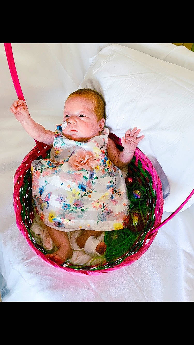 Savanna joined the competition — help win amazing prizes! arm, baby, baby_products, baby_safety, baby_sleeping, baby_toddler_clothing, cheek, child, comfort, event, happy, linens, magenta, pattern, person, pink, sitting, skin, sleeve, textile