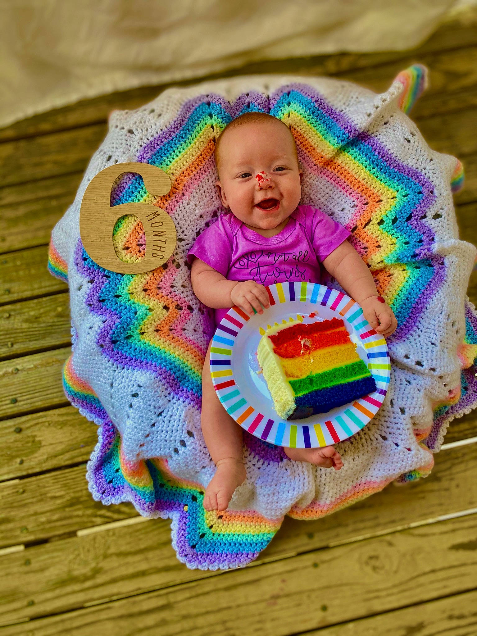 Savanna is registered to the contest to win money with this photo: baby, baby_products, baby_toddler_clothing, dress, fun, grass, hand, happy, head, headgear, magenta, pattern, person, pink, purple, skin, smile, t_shirt, textile, toddler