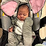 baby, infant, sleeping, elephant_costume, car_seat, harness, gray_clothing, pink, cozy, portrait, indoors, soft_toy, blanket, closed_eyes, peaceful, bedding, baby_feet, seated, child, cuddly