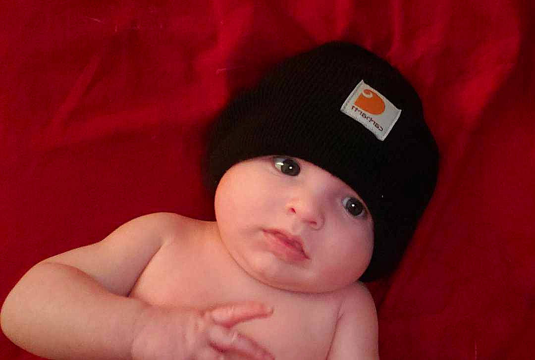 Paxton joined the competition — help win amazing prizes! baby, baseballcap, bathingcap, beanie, bodypart, bonnet, cap, clothing, face, finger, hand, hat, head, newborn, person, photography, portrait