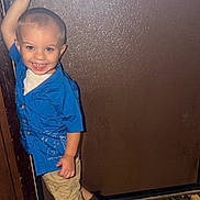 Stefan joined the competition — help win amazing prizes! child, toddler, boy, smiling, portrait, indoor, door, door_handle, blue_shirt, shorts, boots, clothing, standing, posing, happy, face, hair, floor, tiles, home