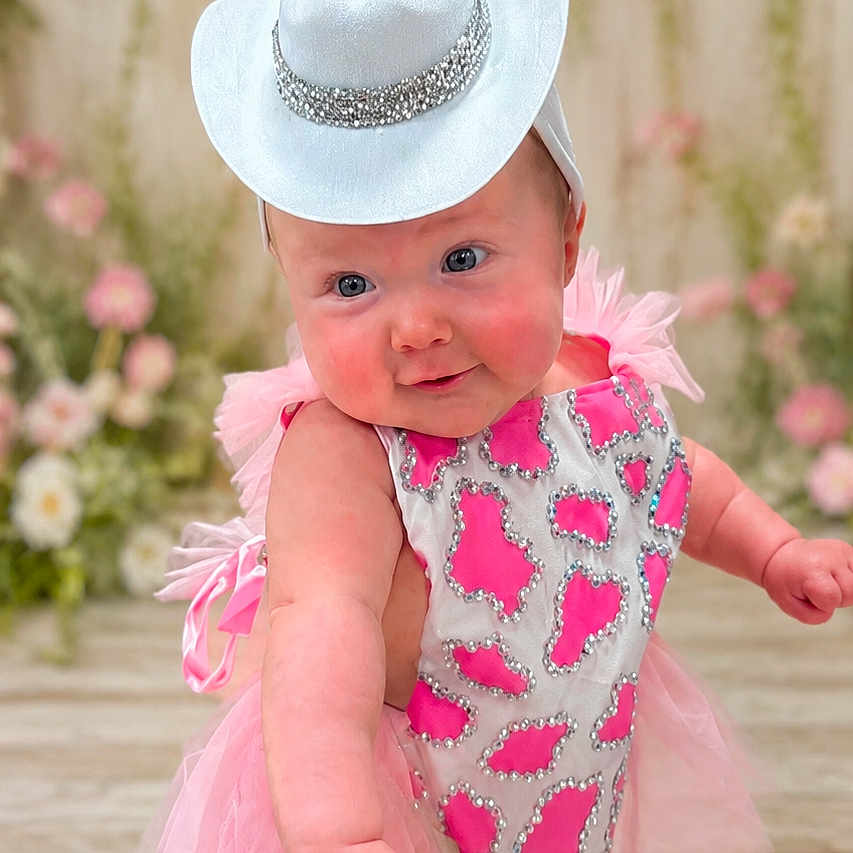 Maizley joined the competition — help win amazing prizes! baby, child, cowboy_hat, pink_dress, sparkles, floral_background, fluffy_rug, cute, portrait, indoor, fashion, tutu, happy, smiling, baby_boots, infant, playful, costume, adorable, person