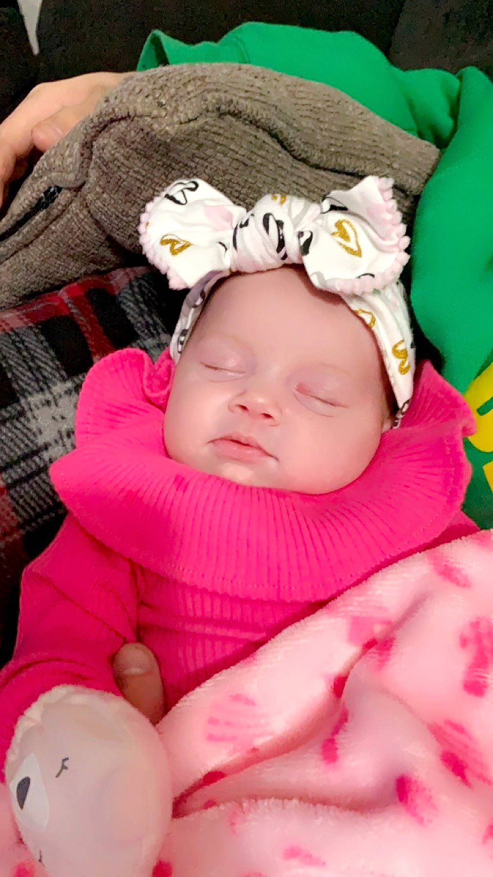 Raelynn is registered to the contest to win money with this photo: baby, baby_products, baby_sleeping, baby_toddler_clothing, cheek, child, comfort, face, facial_expression, grass, headwear, linens, magenta, pattern, person, pink, plaid, skin, sleep, tartan