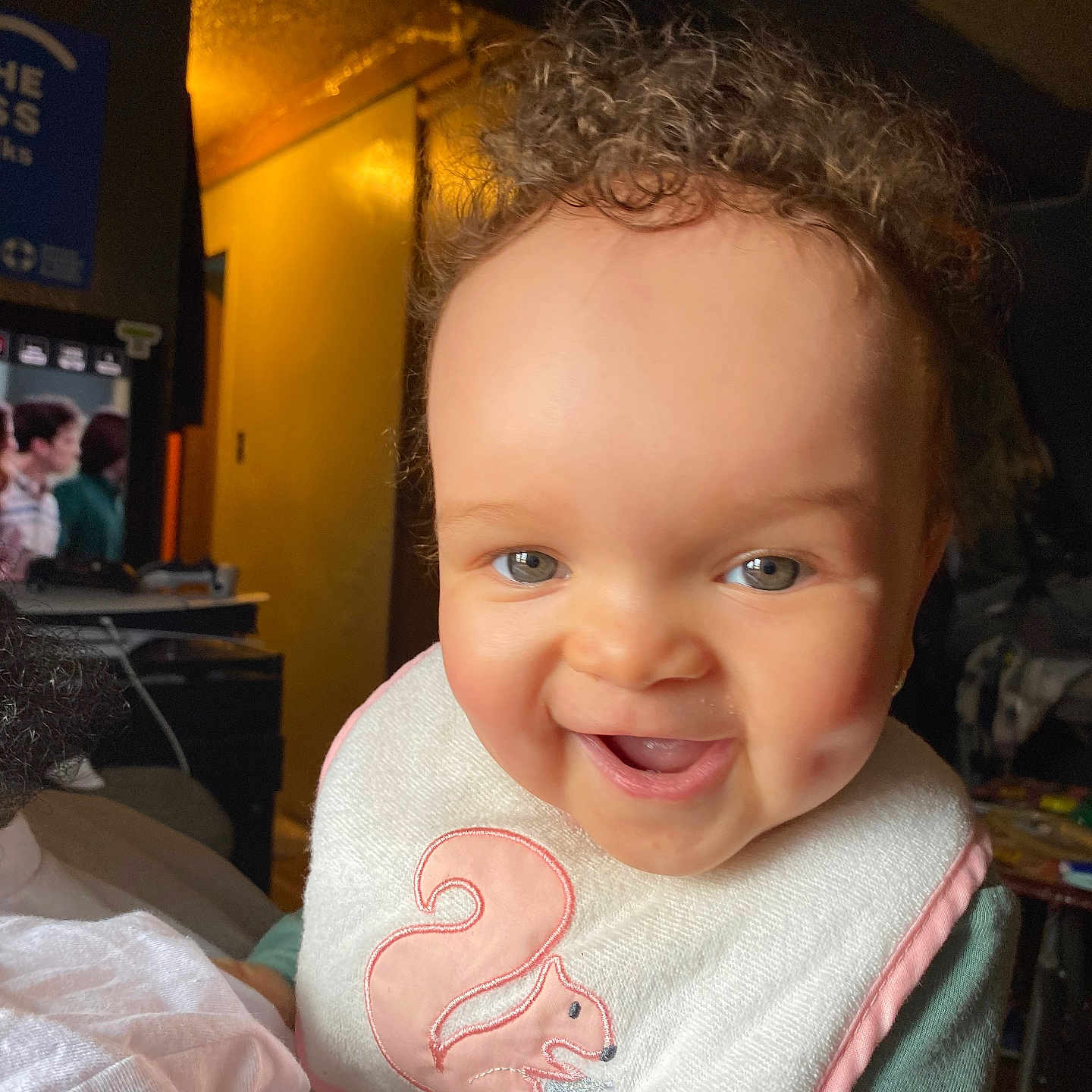 Kalimah joined the competition — help win amazing prizes! baby, babylaughing, bib, bodypart, clothing, cup, face, finger, furniture, hand, happy, head, indoors, laughing, mouth, person, photography, portrait, smile, teeth