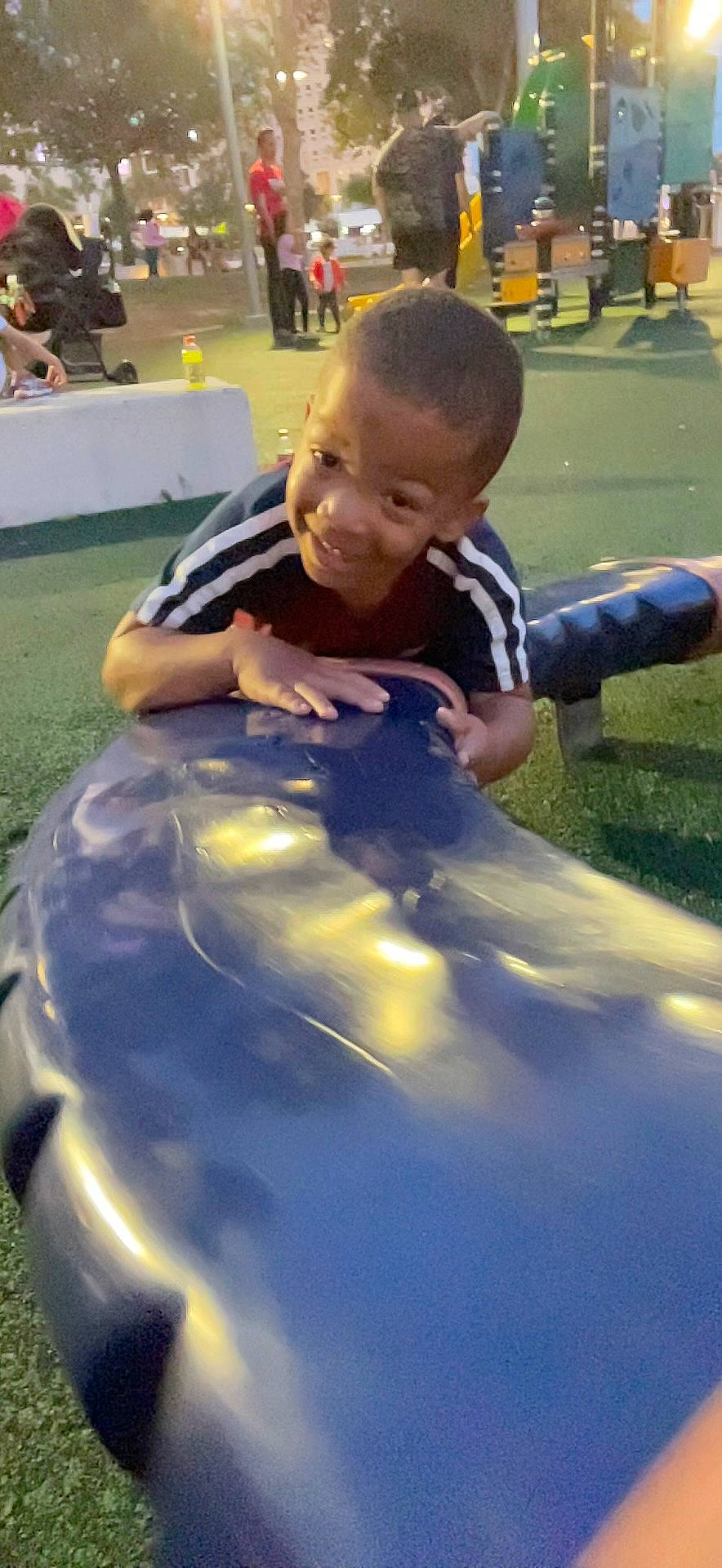 Christopher is registered to the contest to win money with this photo: bumper, chair, child, competition_event, electric_blue, event, fun, games, grass, happy, head, inflatable, leg, leisure, person, play, recreation, sitting, toddler, vacation