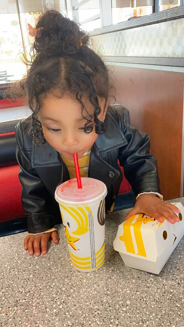 Davina is registered to the contest to win money with this photo: child, comfort_food, cuisine, drink, drinking, drinking_straw, fast_food, food, food_craving, fun, ingredient, junk_food, leisure, non_alcoholic_beverage, person, soft_drink, sweetness, table, toddler, vacation
