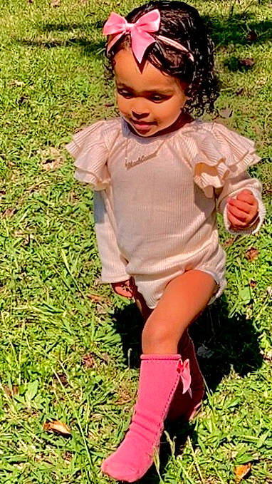 Davina joined the competition — help win amazing prizes! baby_toddler_clothing, ball, blond, child, dress, eye, finger, fun, goggles, grass, happy, headpiece, headwear, lawn, people_in_nature, person, pink, plant, shorts, smile